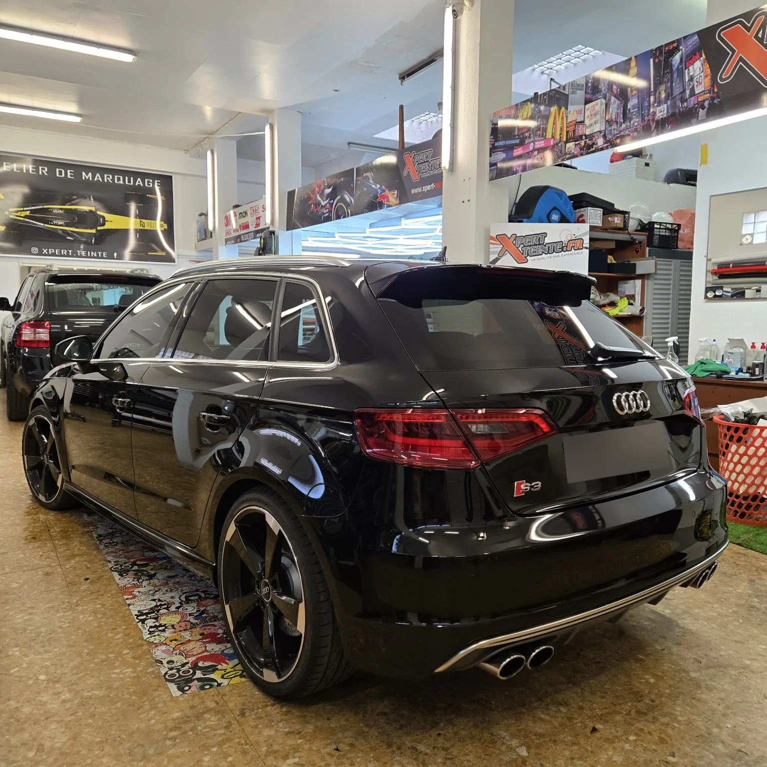 Vue arrière gauche de l’Audi S3 Sportback après les traitements des vitrages et des optiques.